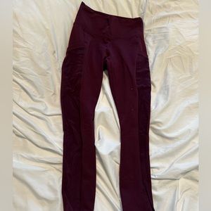 purple fabletics’s leggings with mesh pockets and sides